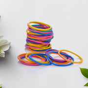 Assorted multicolor elastic bands for office, kitchen, and school supplies.