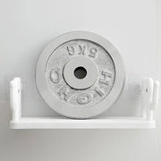 Stylish elephant wall shelf organizing small items on a bathroom wall.