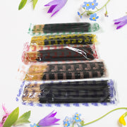 Lit Pancham incense stick releasing fragrant smoke, creating a calming atmosphere.