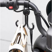 Multi-purpose stroller hook holding shopping bags and a purse on a pram.