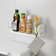 No-punch elephant wall shelf providing storage in a modern bathroom.