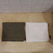 The versatile kitchen apron neatly packaged, ready for daily home or commercial use.