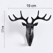 Stylish deer head hook in grey, functioning as a decorative hanger for a hat.