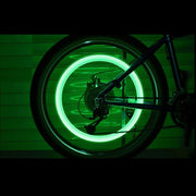 Dynamic LED valve caps shown on both a bicycle and a car tire for comparison.