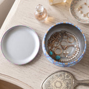 Decorative metal container with mandala pattern for storage