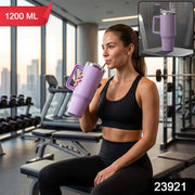 Purple stainless steel tumbler with carry handle and straw