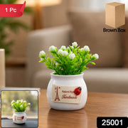 Faux bonsai plant with white flowers in a ceramic pot
